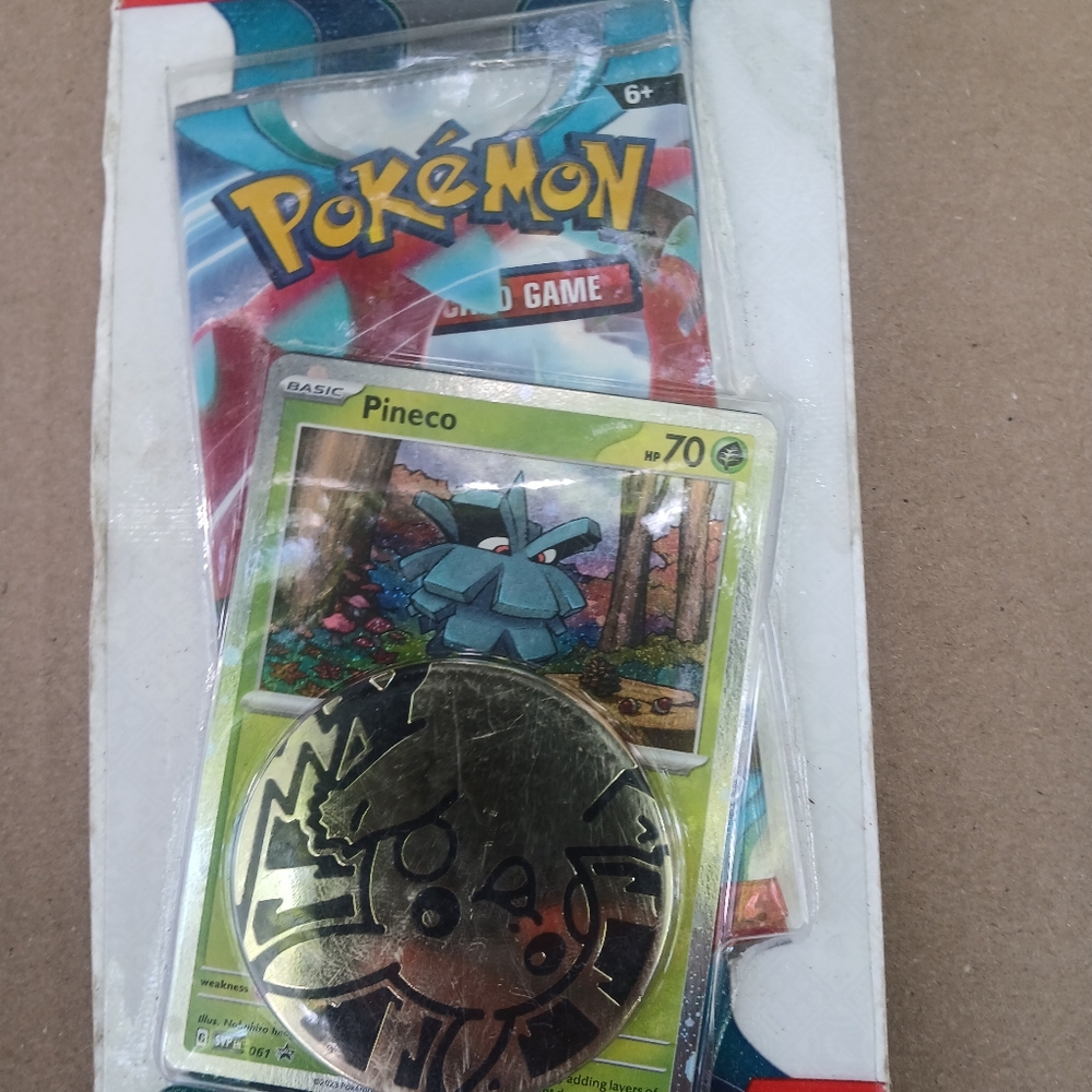 Pokémon Trading Card Game with Pineco Card and Pikachu Coin